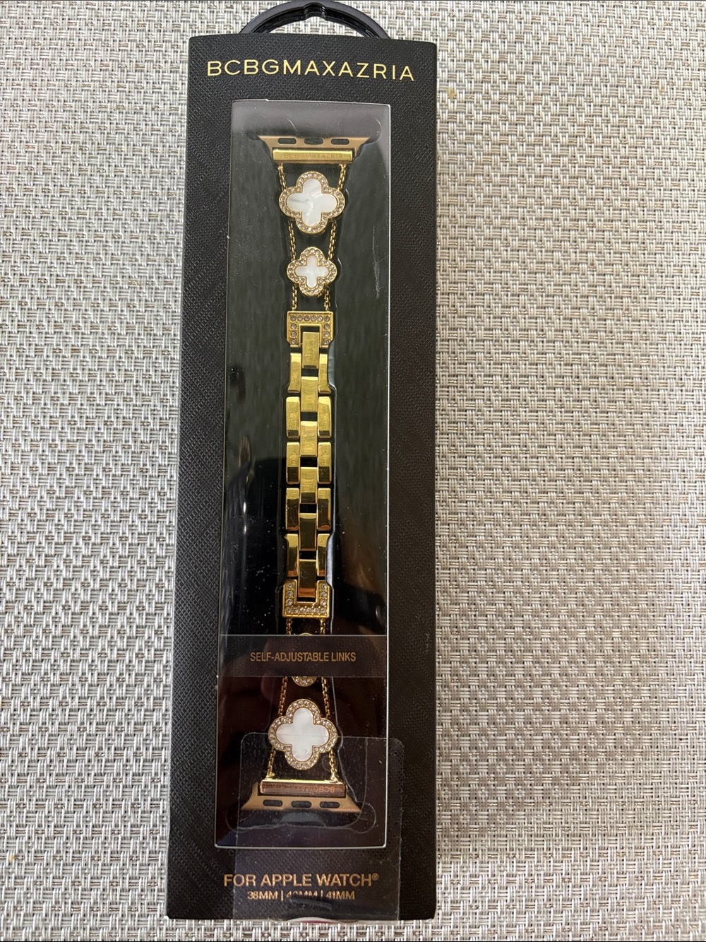 Brand new BCBGMaxAzria Gold and White Clover Link Apple Watch Band